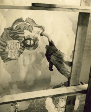 My dad Eugene standing on his scaffolding painting the ceiling of one of his churches.